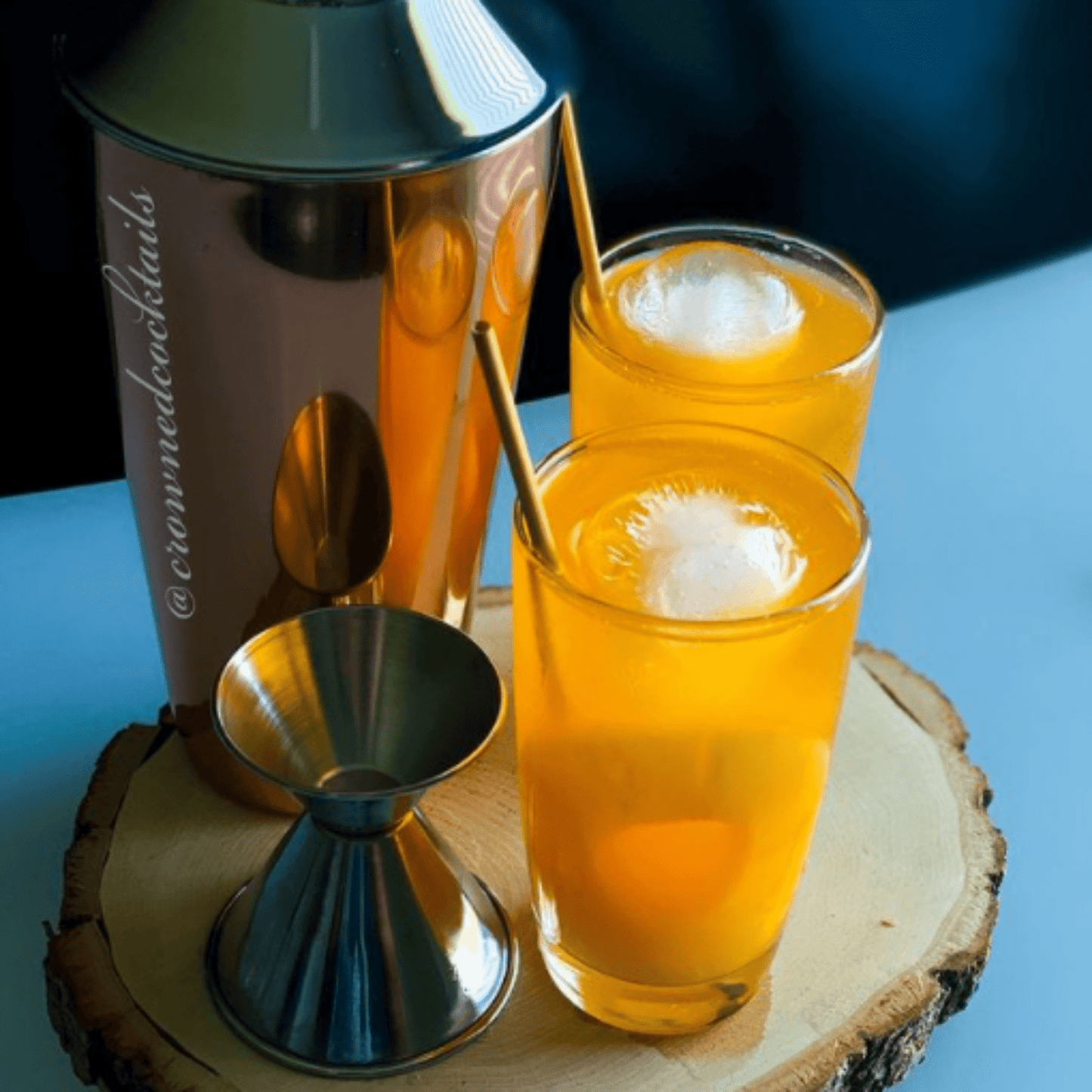pair of orange infused drink accompanied with mixer