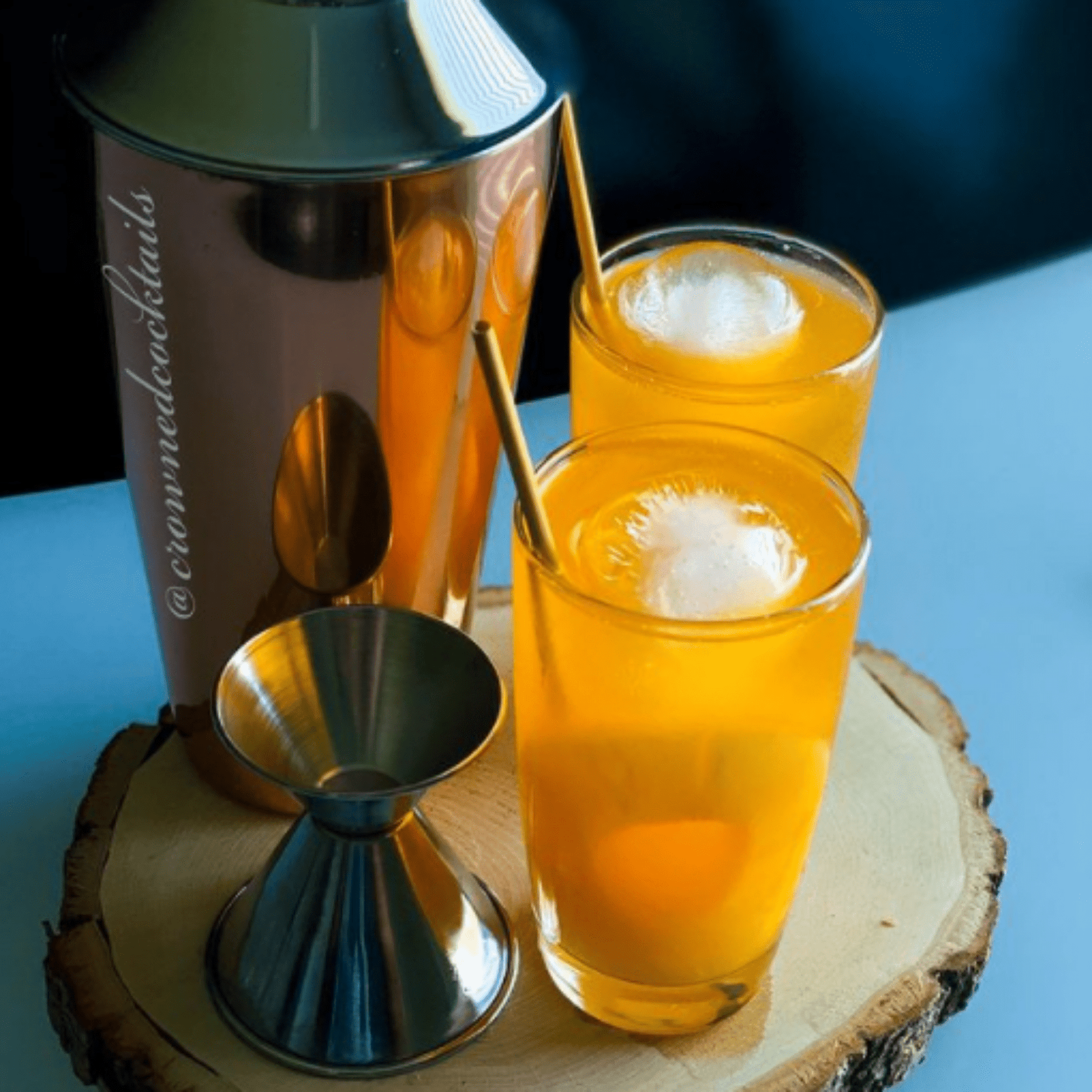 pair of orange infused drink accompanied with mixer